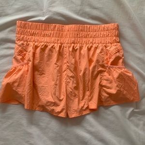 Free People-Get your flirt on shorts. Lightly worn, size medium, orange.